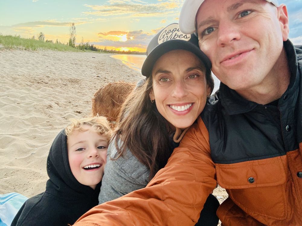 Ryan, Amanda, and Bennett on a Northern Michigan beach