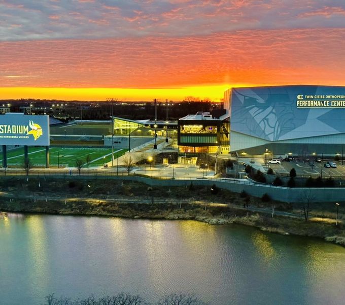A team stadium and performance center at sunset