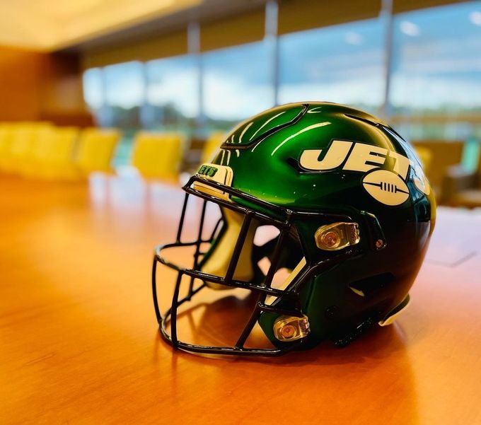 A New York Jets helmet on a conference table