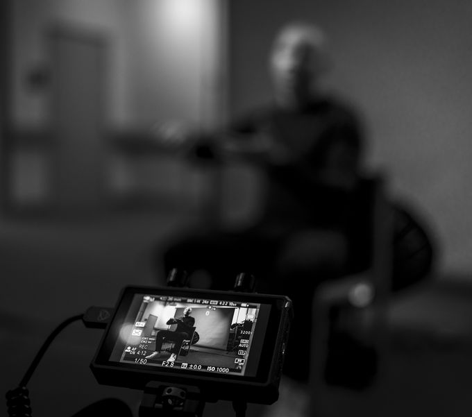 A camera monitor showing Ryan during an interview