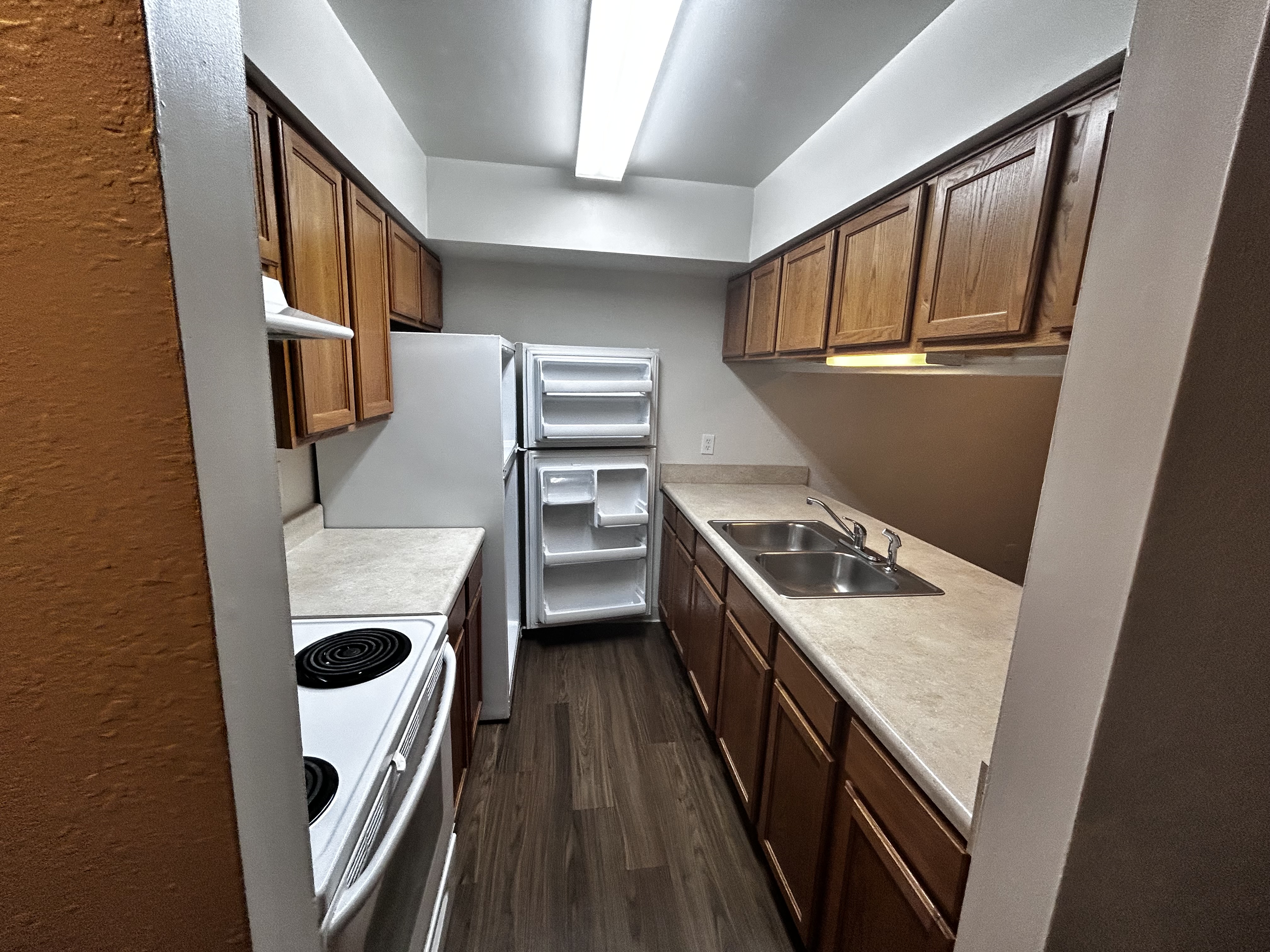 Galley kitchen with pass-through at The Crossings