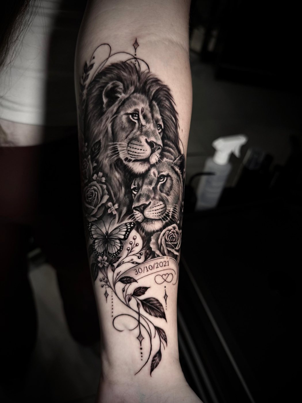 Black and grey lion and cub forearm tattoo by Valerio at Squires Ink, Surfers Paradise