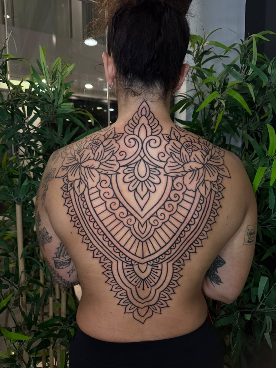 Ornamental back piece by Augusto at Squires Ink, Surfers Paradise