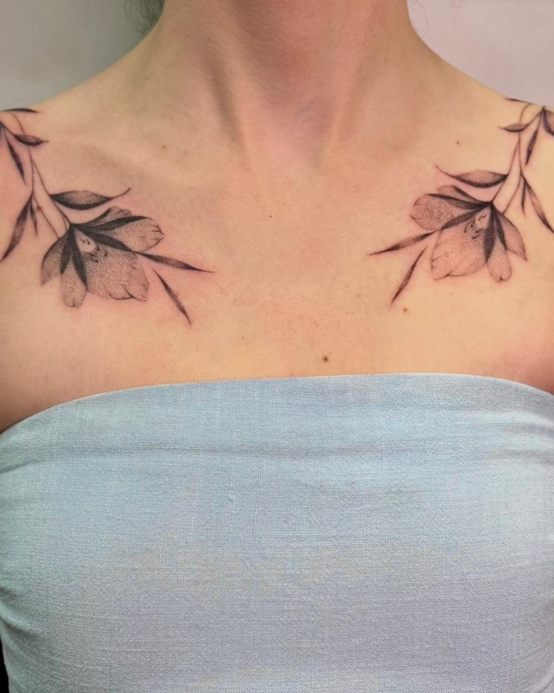 Matching fine line floral collarbone tattoos at Squires Ink, Surfers Paradise