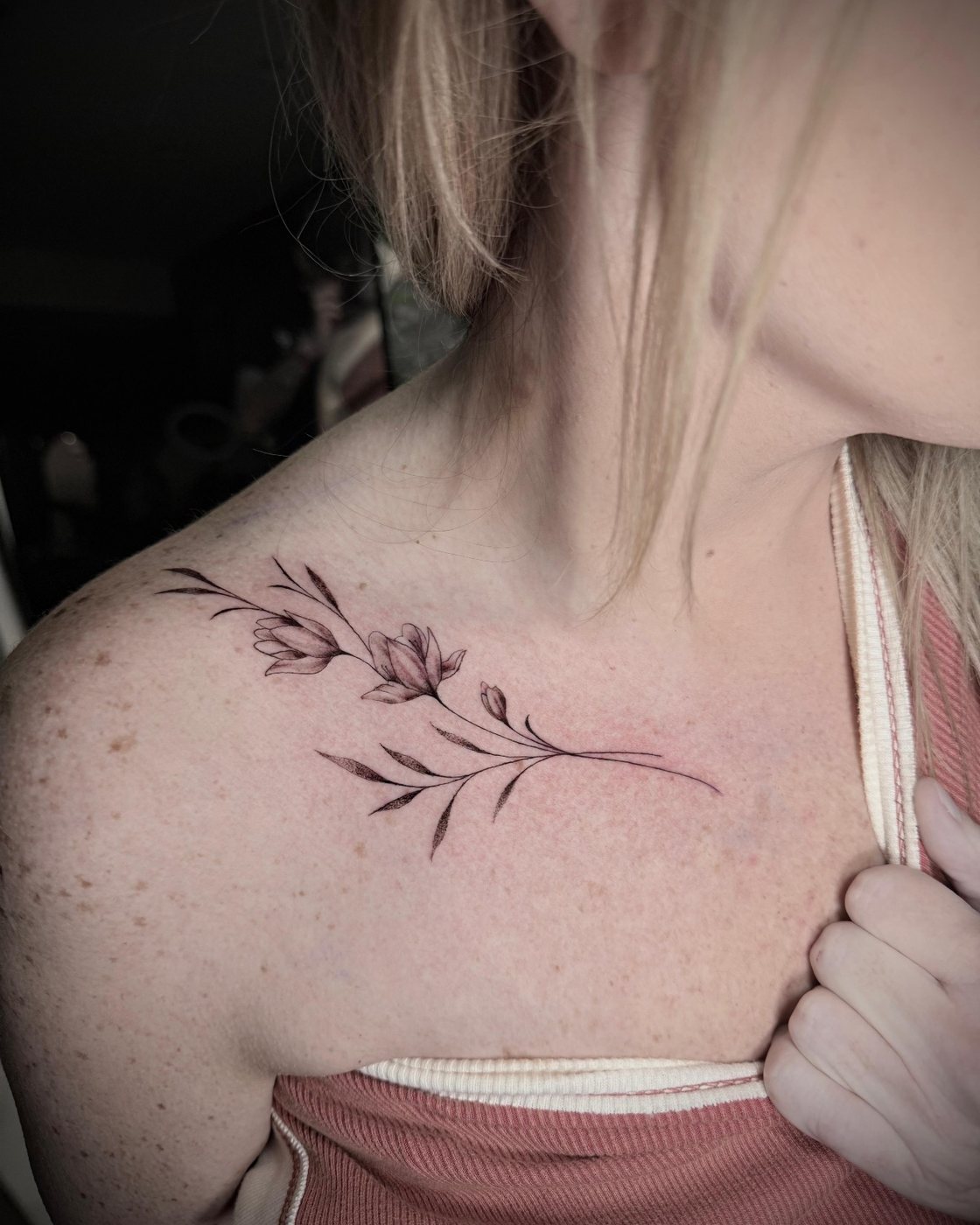 Fine line floral sprig collarbone tattoo at Squires Ink, Surfers Paradise