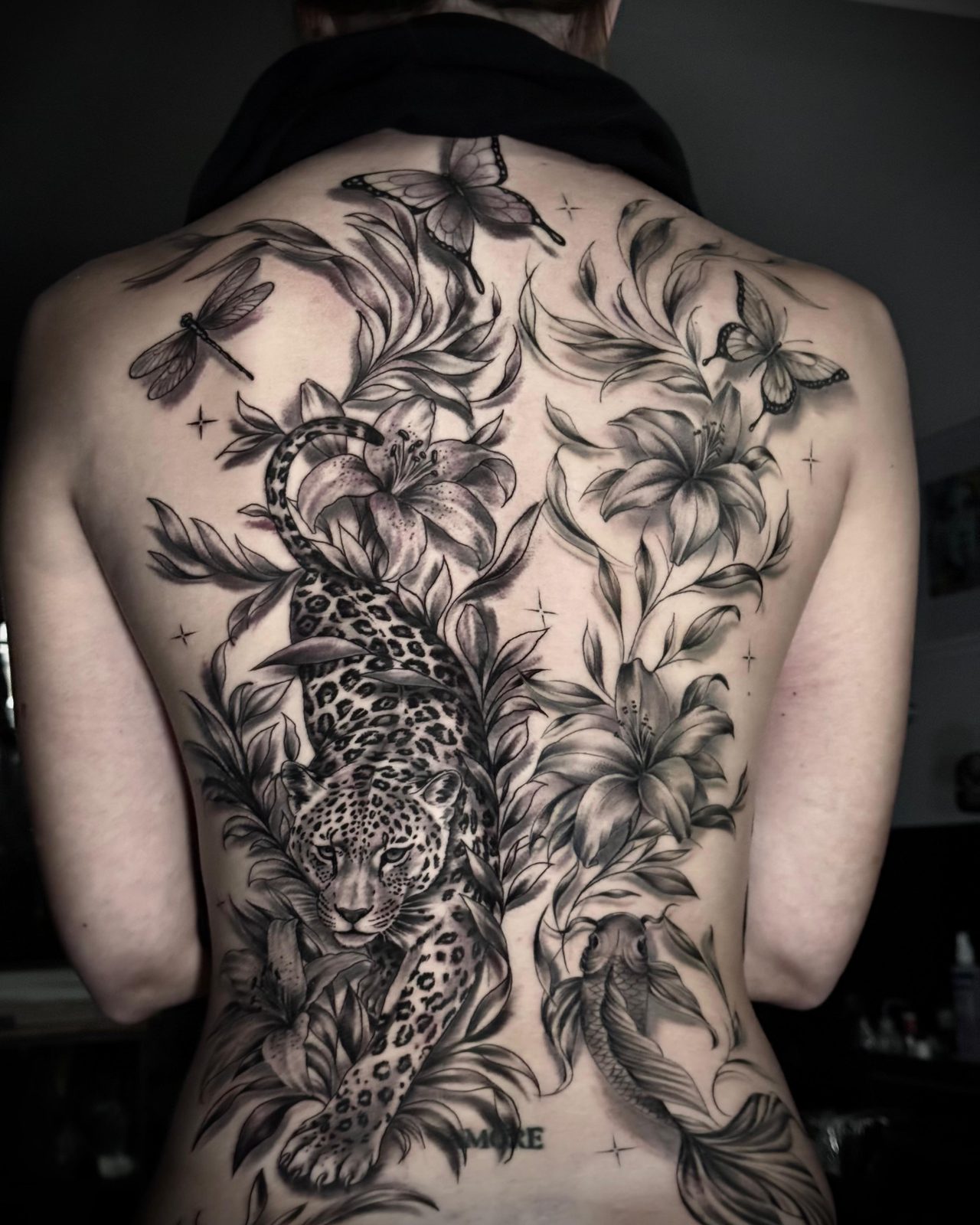 Black and grey leopard, lilies, butterflies and koi full back piece by Valerio at Squires Ink, Surfers Paradise