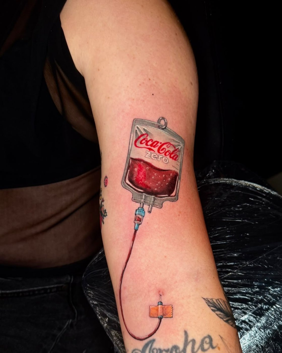 Colour realism IV drip bag tattoo on the forearm by Alejandro at Squires Ink, Surfers Paradise
