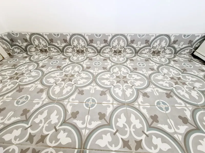 Close-up of patterned grey and white floor tiles