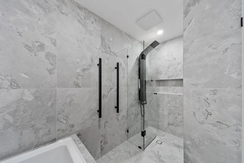 Shower tiling in Craigburn Farm, with a wall niche and matte black fittings