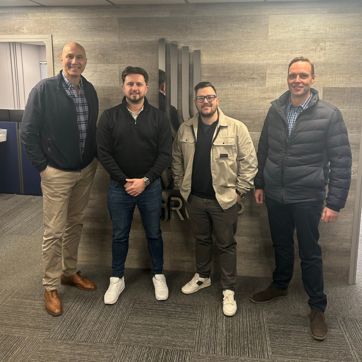 Neil Sewell, Joe Sadler, Jack Miller and Steve McWilliam celebrating the partnership between Traverse Automation and Lazenby Group
