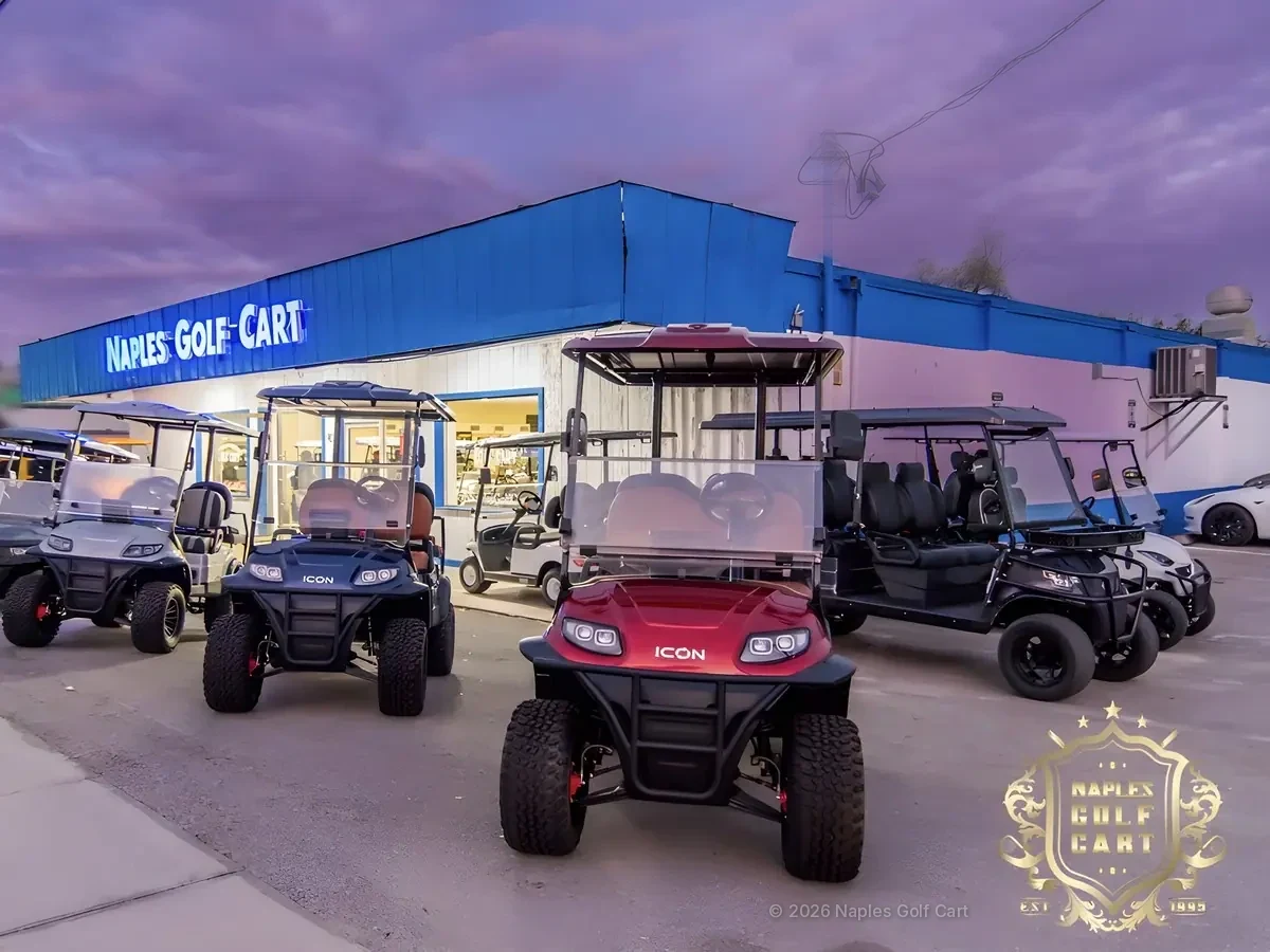 Naples Golf Cart showroom on Airport-Pulling Road at dusk with ICON golf carts out front