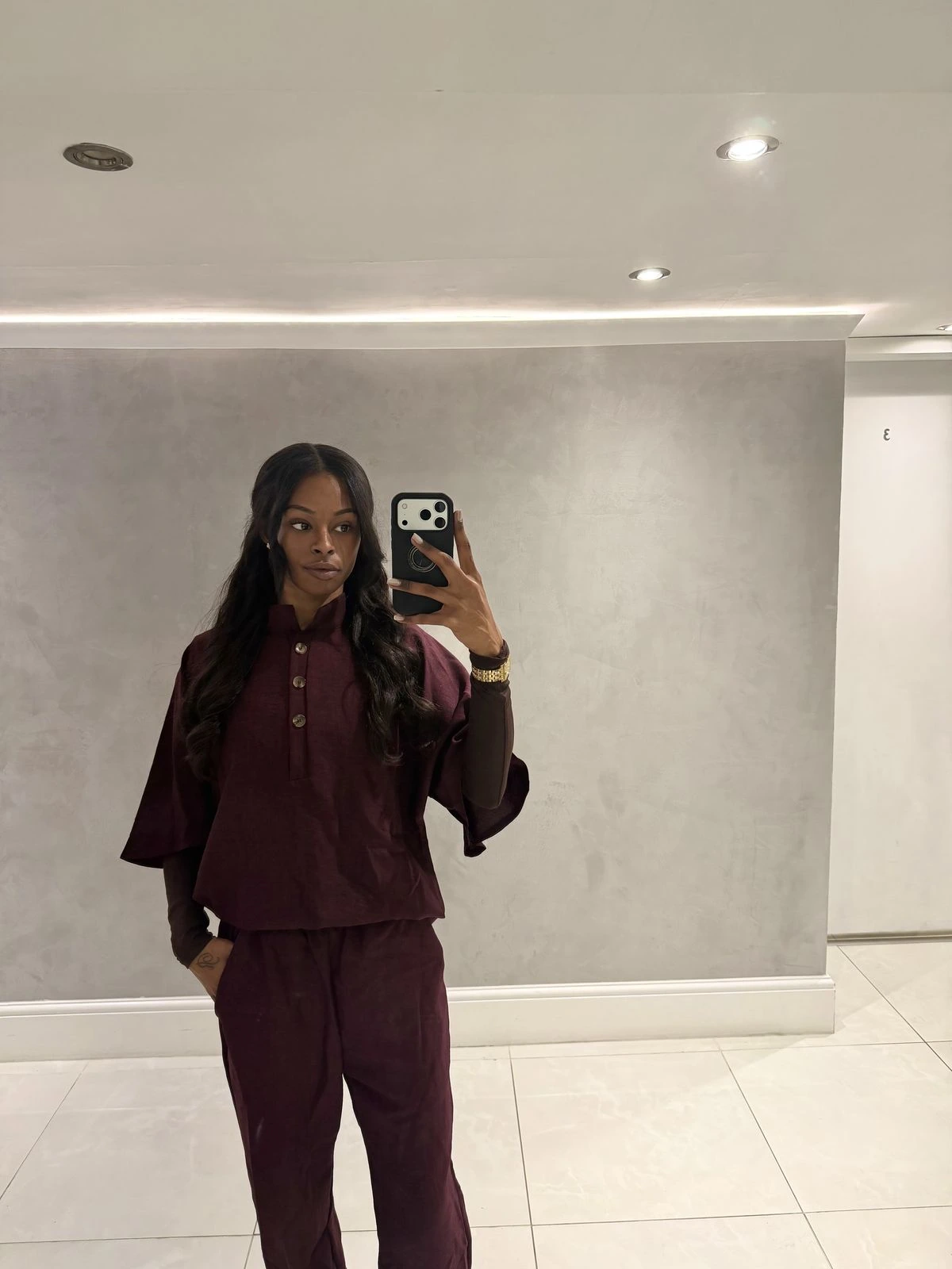 Jordy Lord-Ffrench, founder of The Ffrench Lash, in her plum studio uniform
