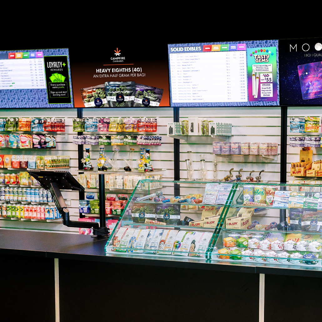 Inside Lindström Canna — the retail counter, display case, and menu screens
