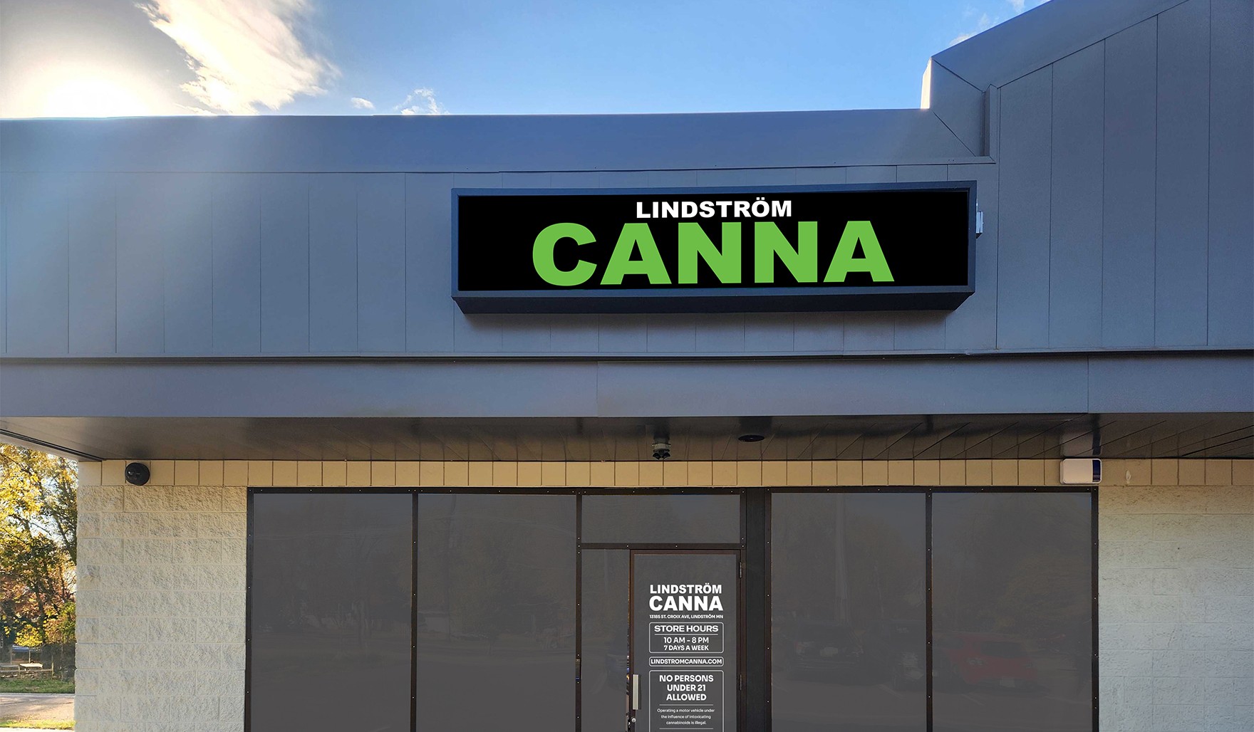 Lindström Canna storefront on St Croix Avenue, with the illuminated sign above the entrance