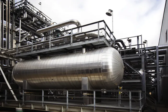 Horizontal stainless steel vessel at a processing facility