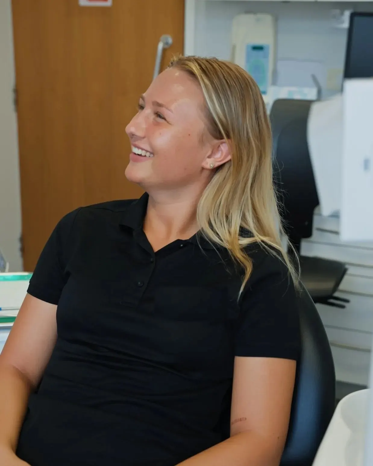 A patient smiling and relaxed in the dental chair at Sale Dental Spa