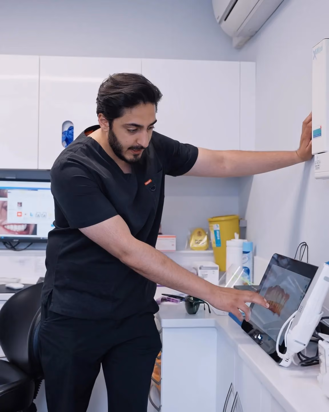 Dr Hamza taking a 3D scan with the iTero scanner at Sale Dental Spa