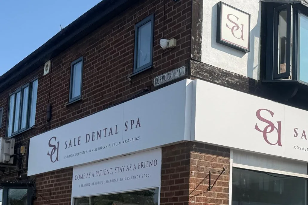 Sale Dental Spa on the corner of Washway Road and Roebuck Lane, with the Sd sign hanging above the corner