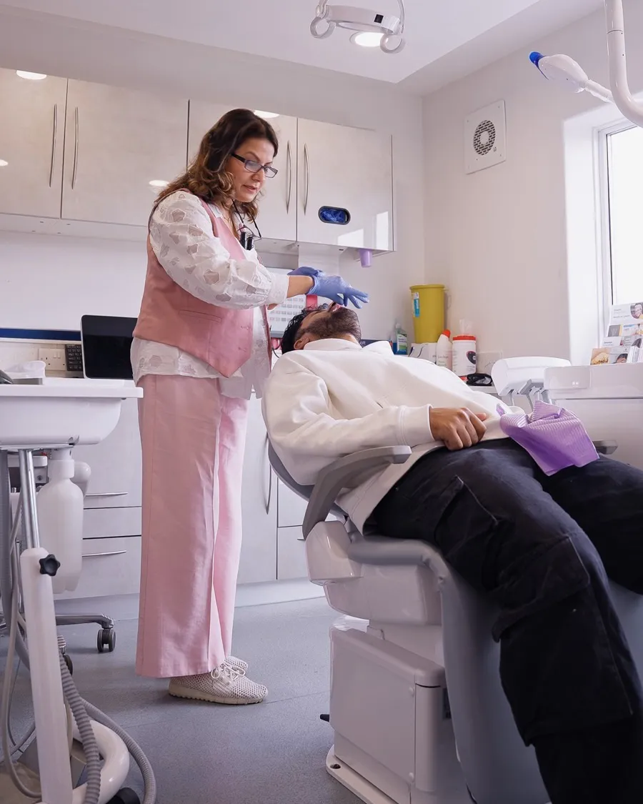 Dr Aisha Ahmed treating a patient at Sale Dental Spa