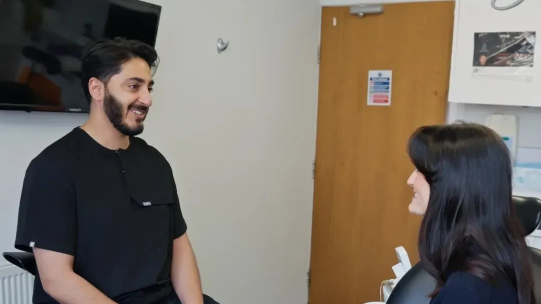 Dr Hamza designing a smile with Katie on screen at Sale Dental Spa