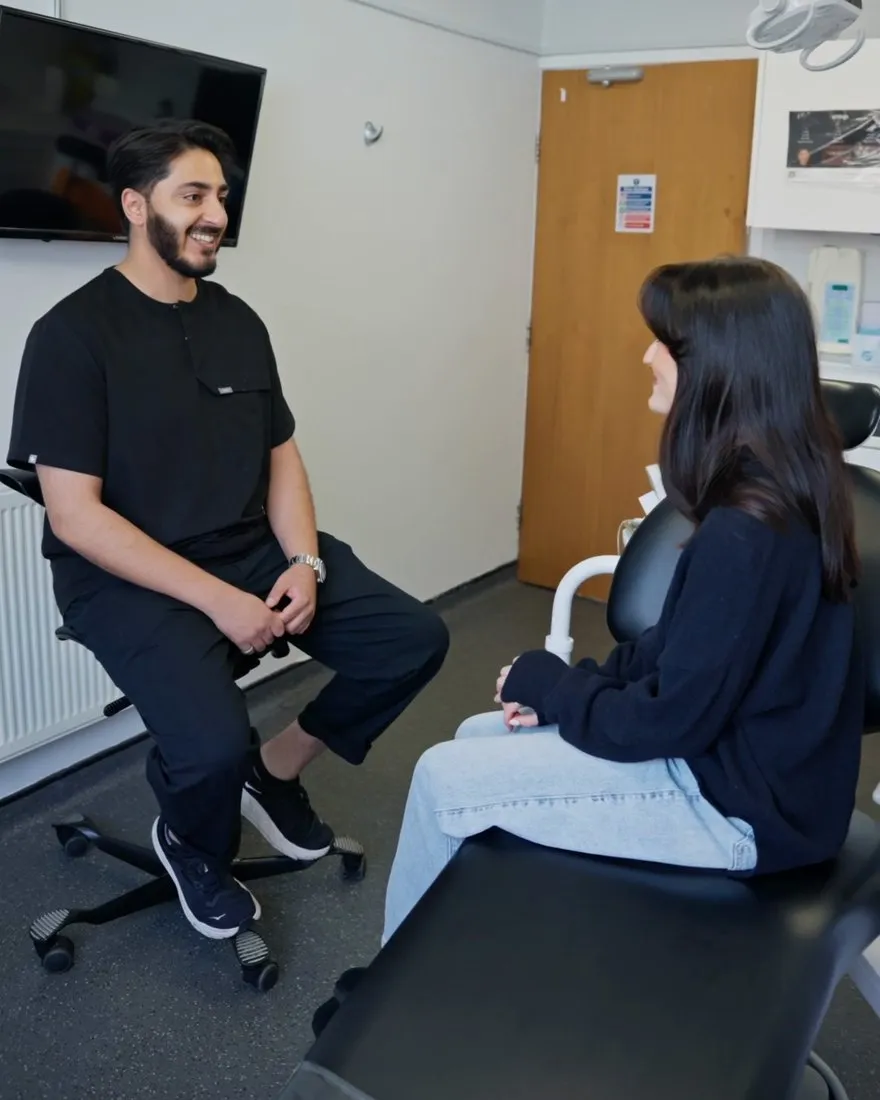Dr Hamza designing a smile with Katie on screen at Sale Dental Spa
