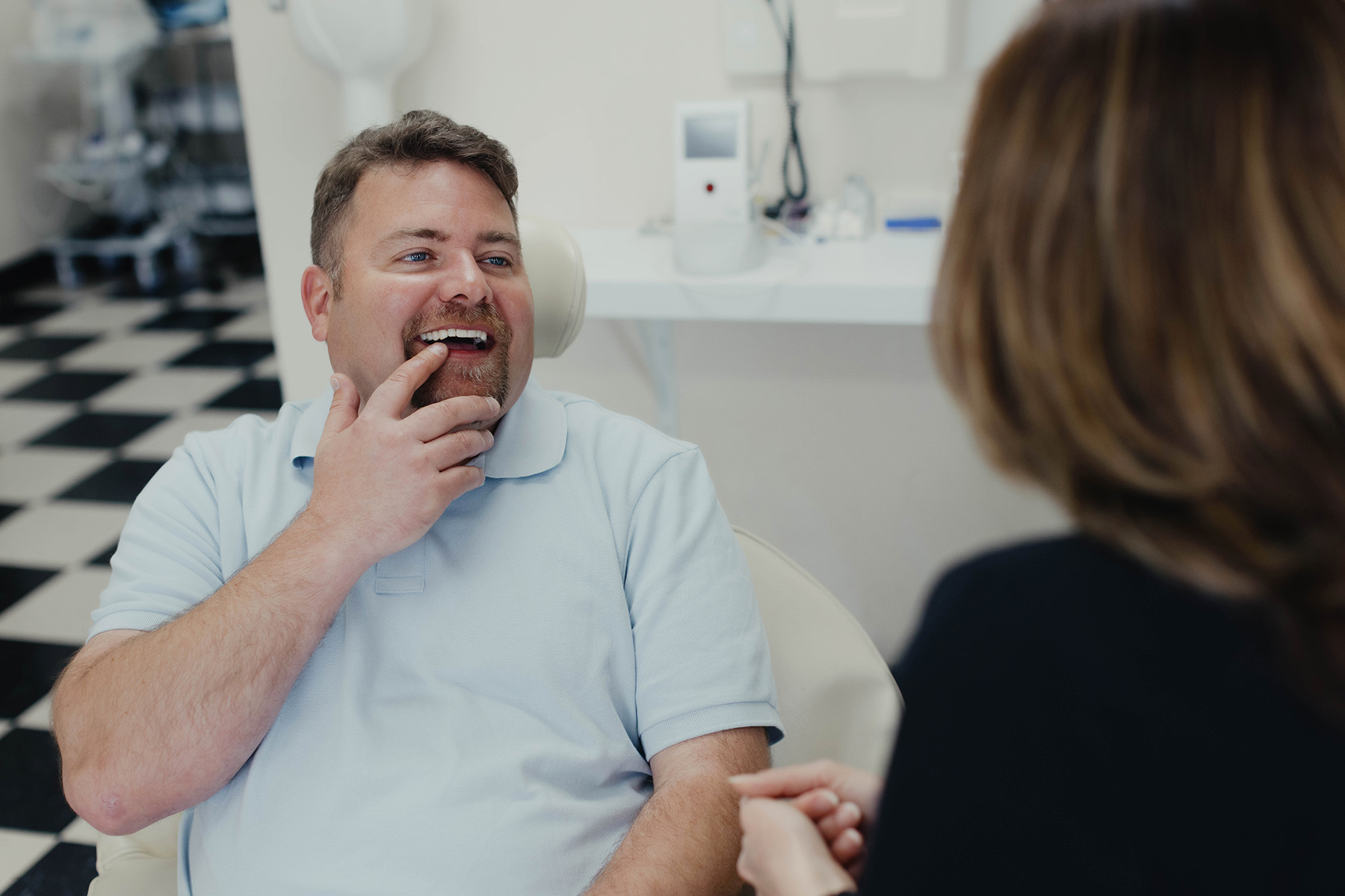 Male patient pointing at his teeth