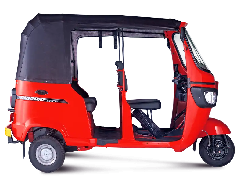 Red TVS King Deluxe passenger three-wheeler