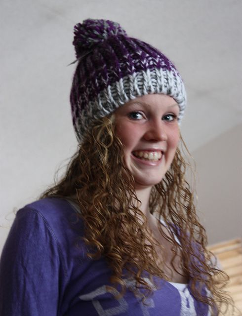 Jordan in her purple knit hat, smiling