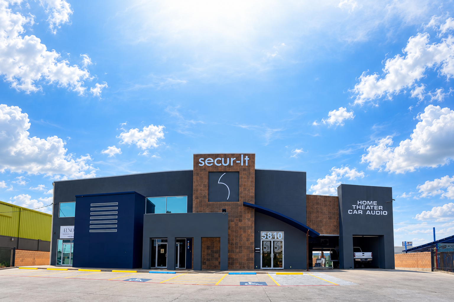 Secur-It storefront in Laredo with an edited cloud-filled sky.