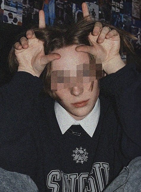 Decode e-boy making horns with his hands