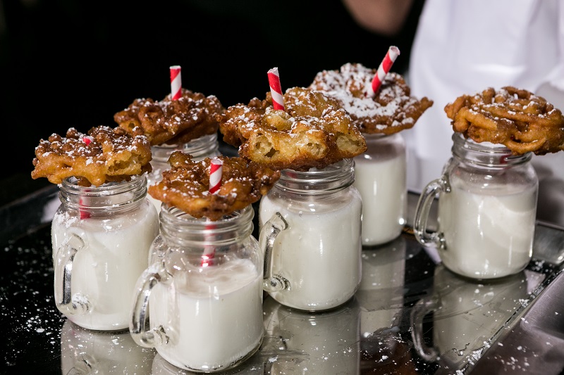 Cookies and milk dessert served in mini milk jugs