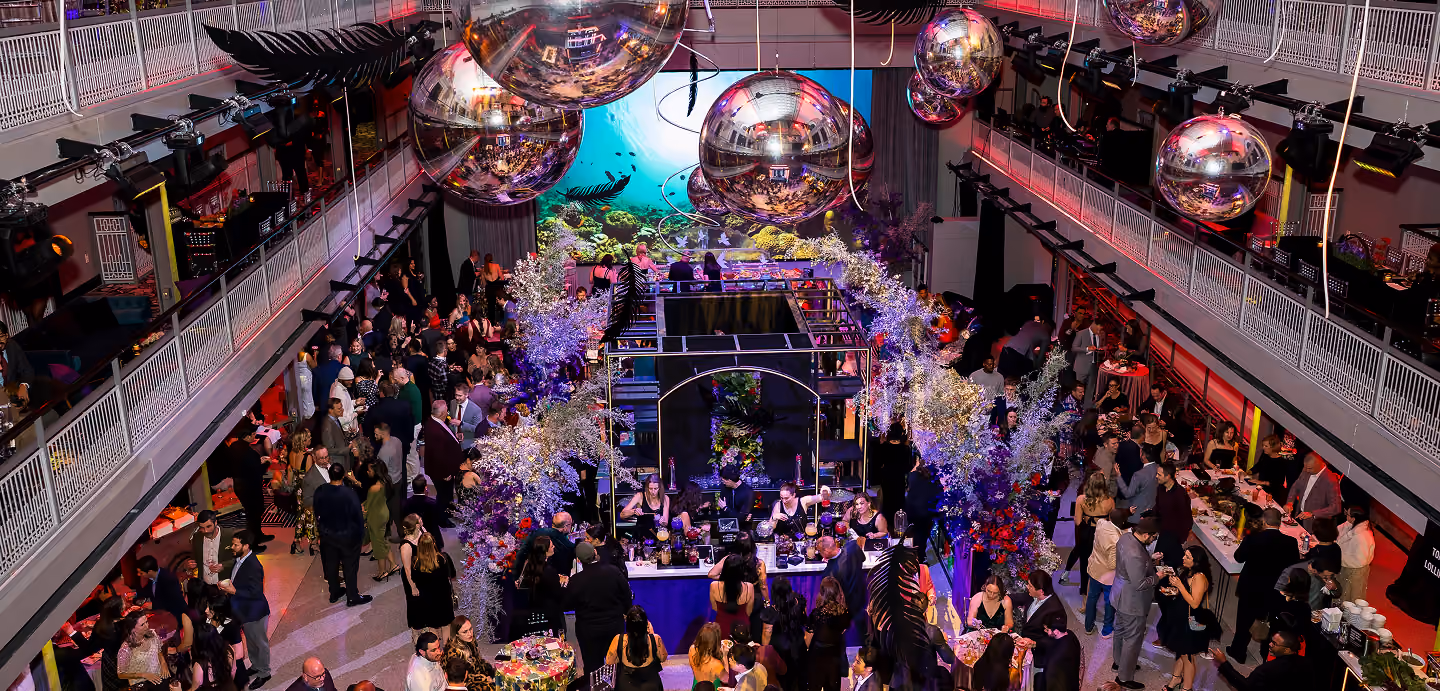 Corporate gala in a grand hall decorated with mirror balls