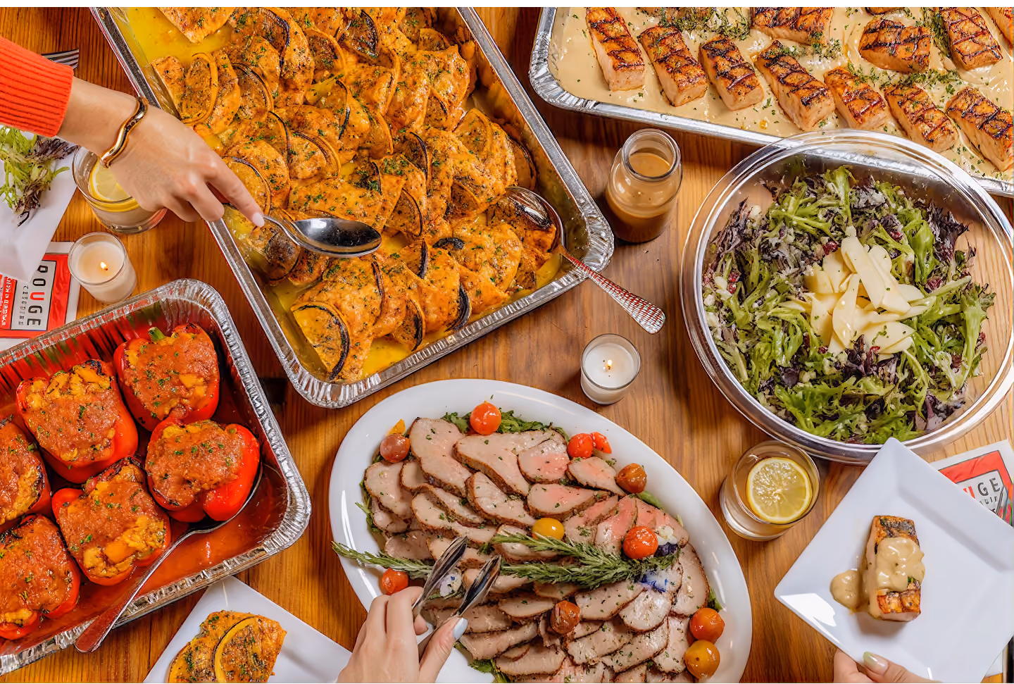 Simply Delivered drop-off catering spread of stuffed peppers, sliced beef and salad