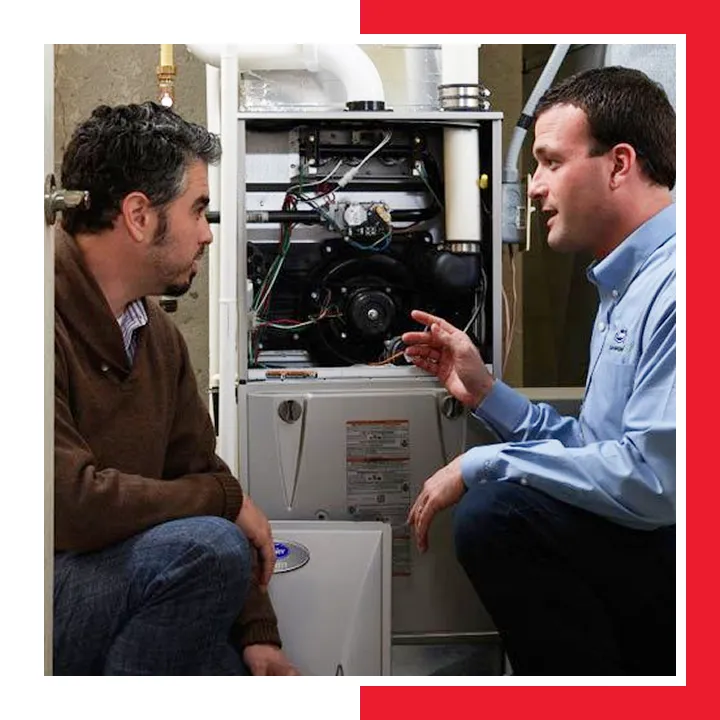 E.A.C. technician explaining a furnace repair to a Hilton Head homeowner