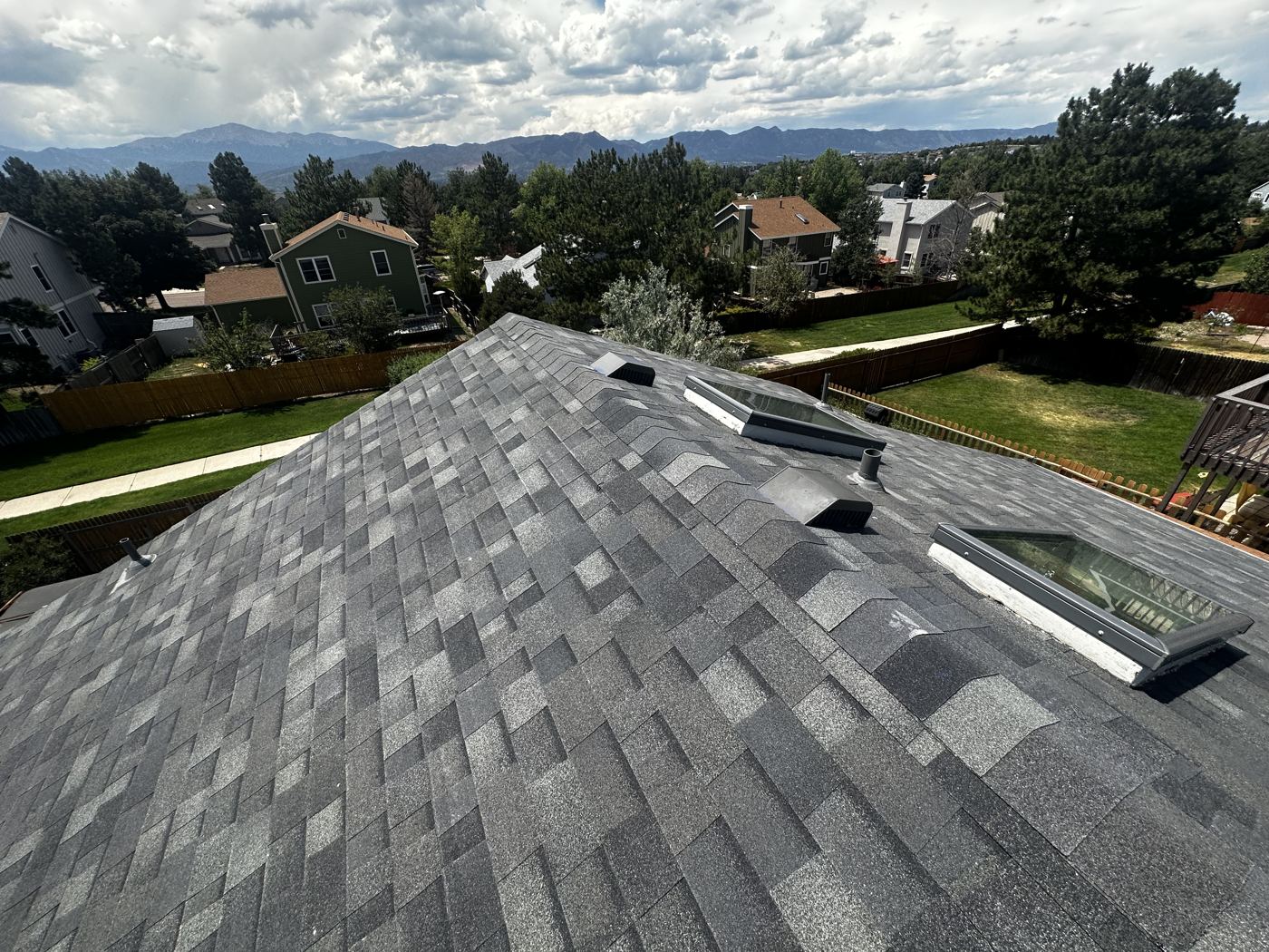 New shingle roof with skylights and mountain views