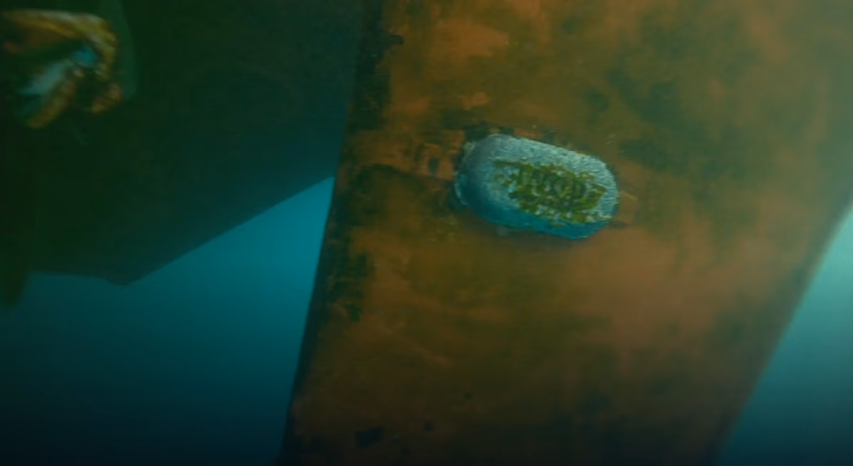 Hullbot inspection footage of a rope entangled on a vessel hull