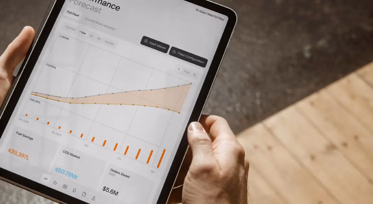 Hullbot hull performance dashboard on a tablet, charting fuel and efficiency data