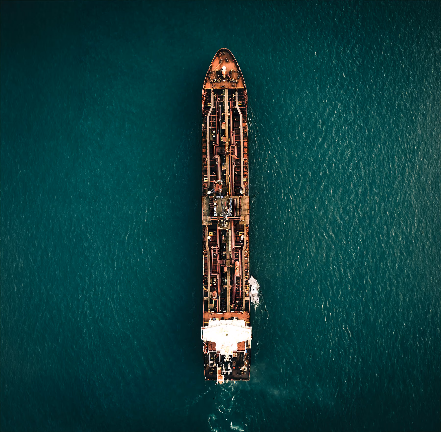 Aerial view of a tanker under way on deep green water