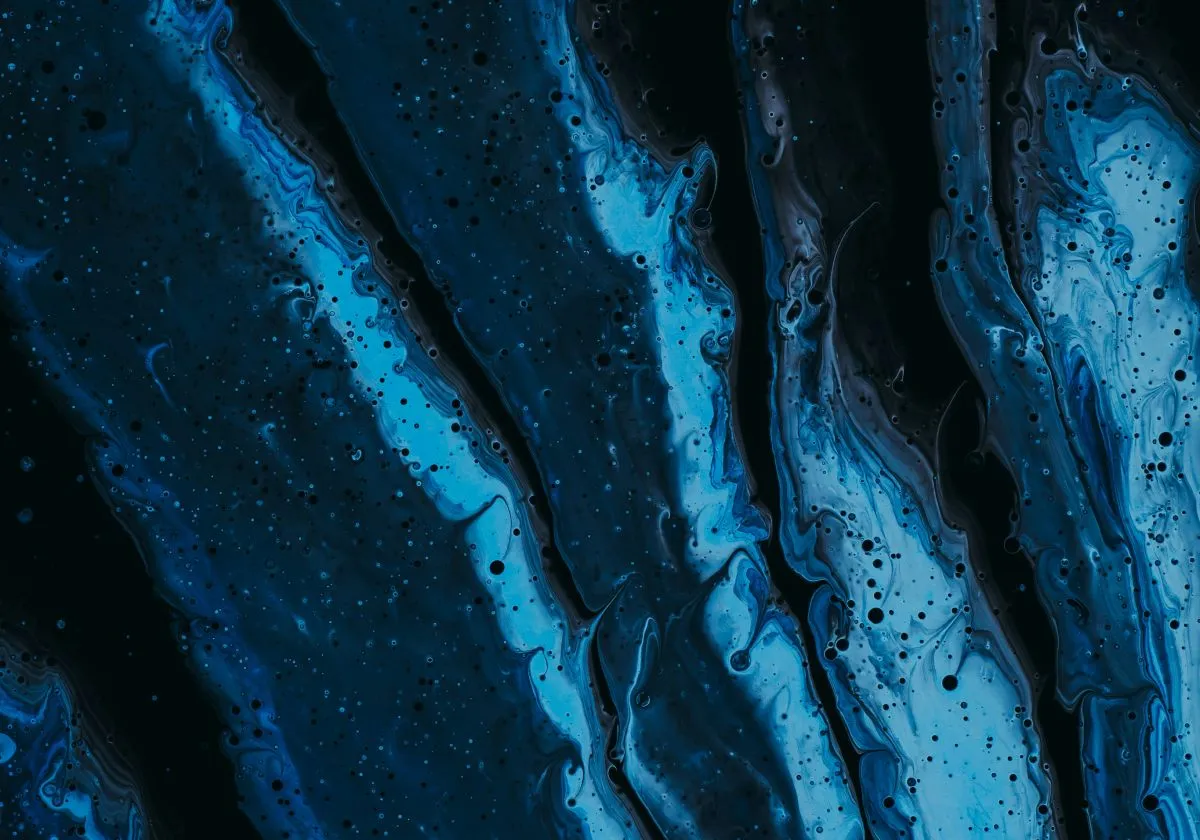 Close-up texture of blue and black hull paint