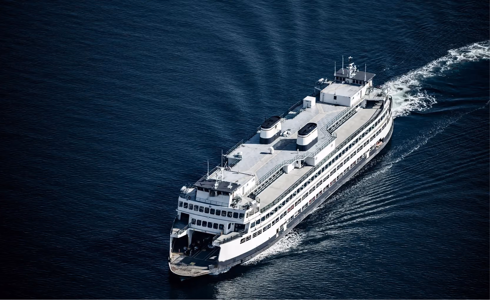 Aerial view of a large Ro-Pax ferry crossing dark blue water