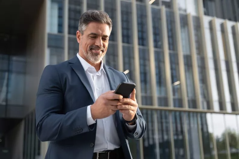Executive checking his phone