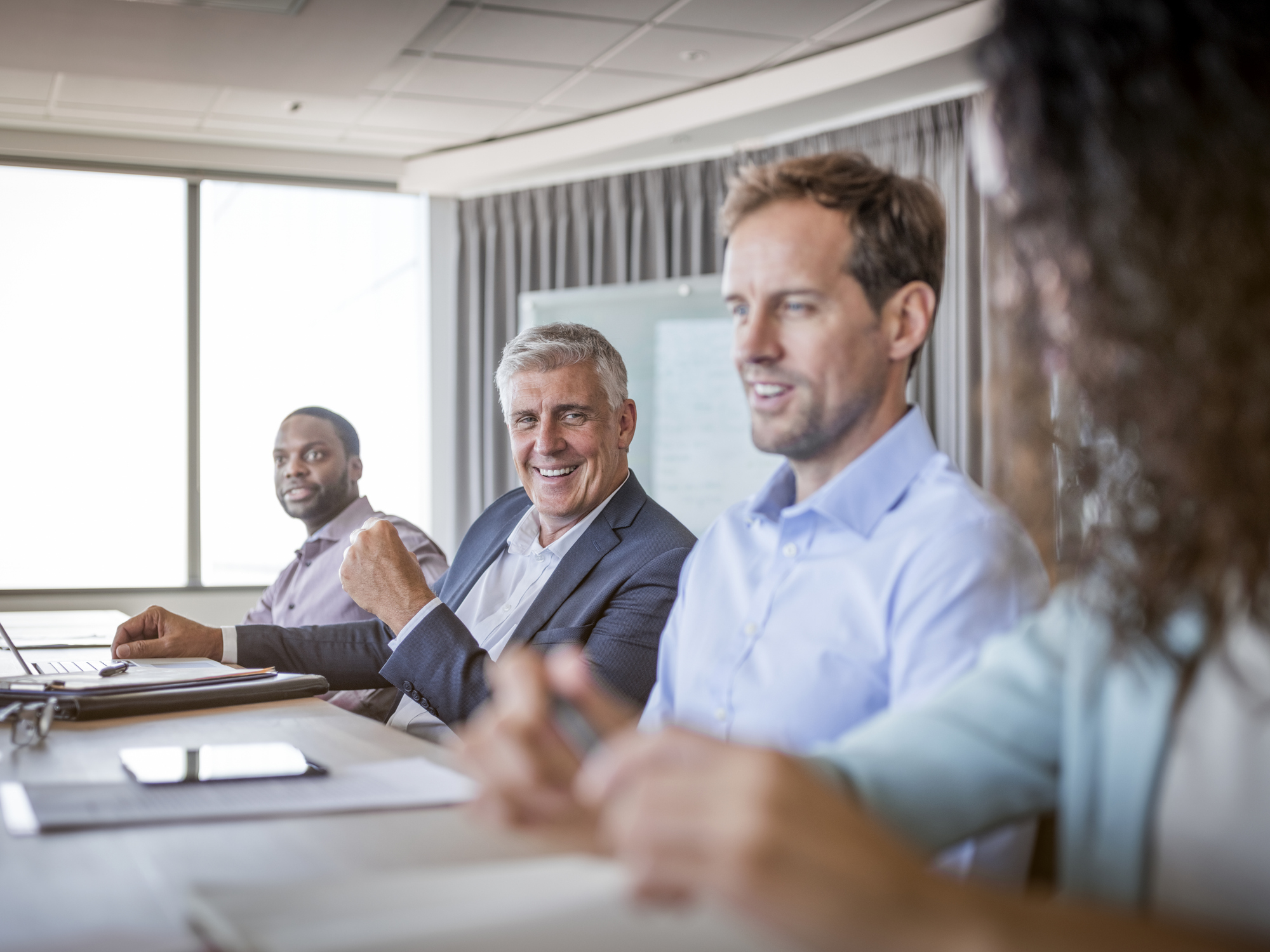 Executive leading a leadership team meeting