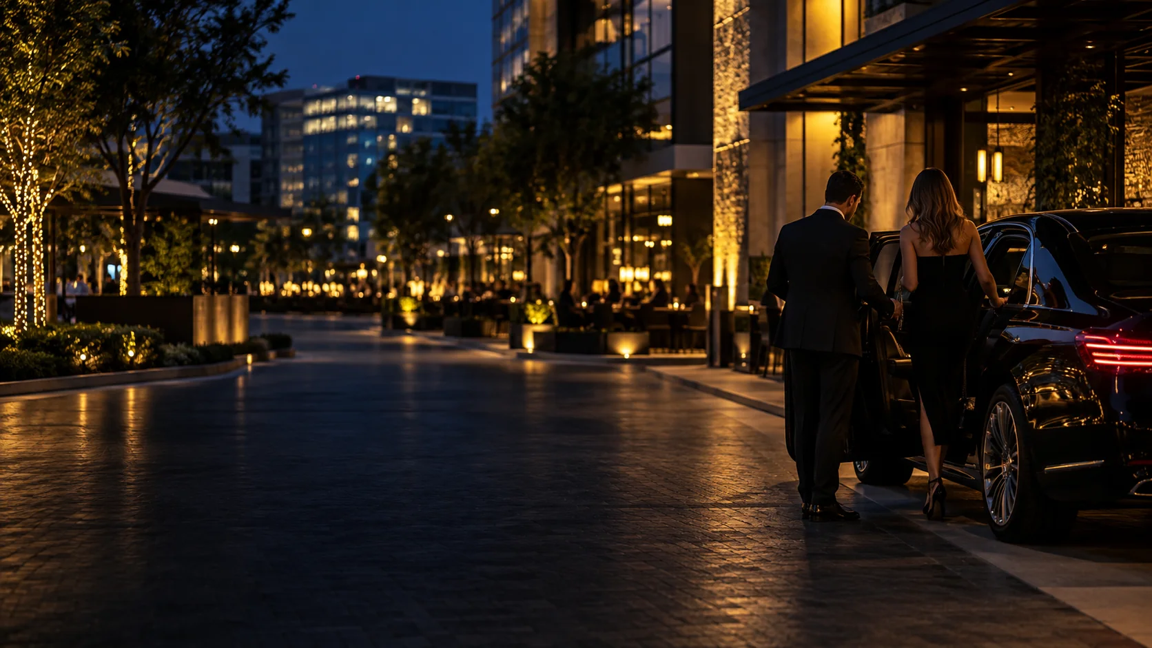 Chauffeur meeting a client on a lit street in Legacy West, Plano, Texas