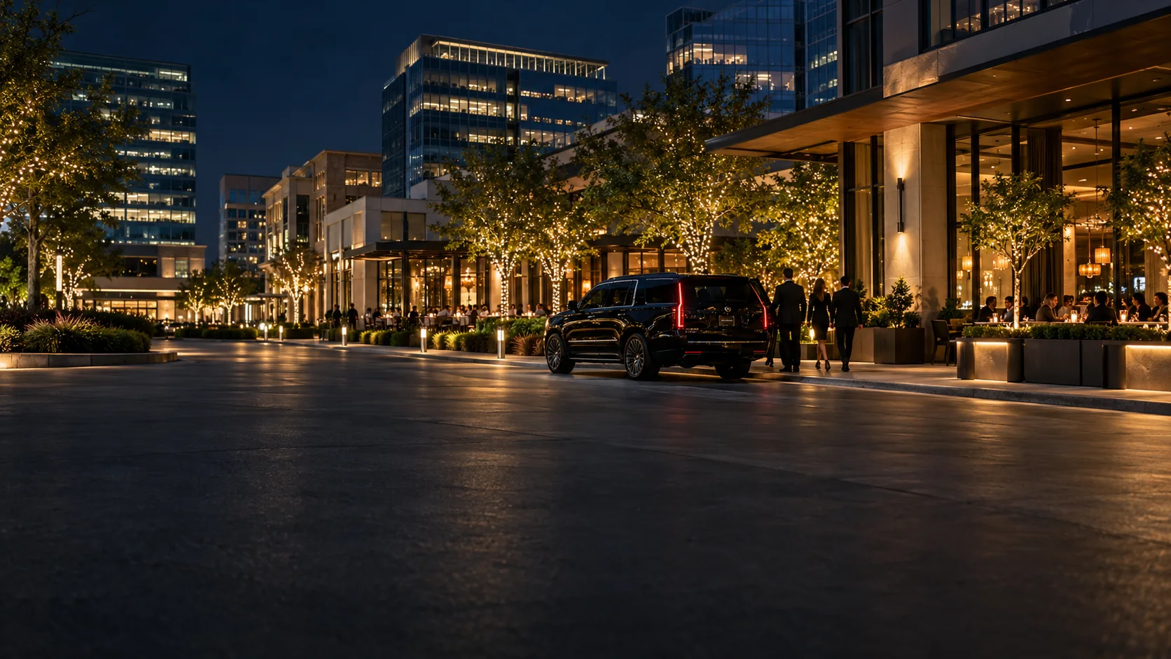 Black SUV chauffeur service on a tree-lined street in Legacy West, Plano at night