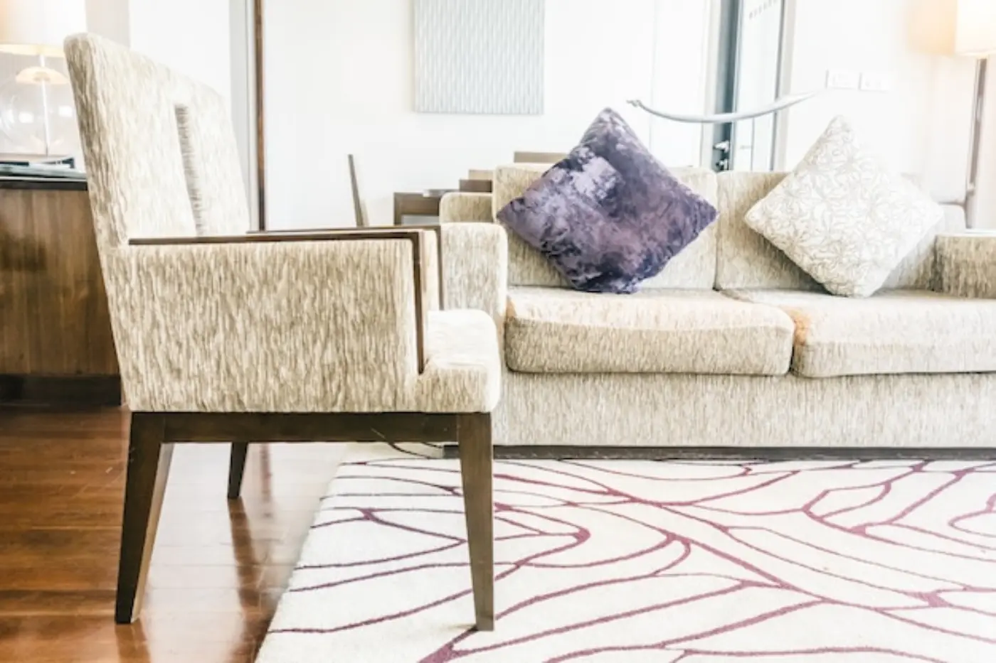 Living room with sofa and patterned carpet