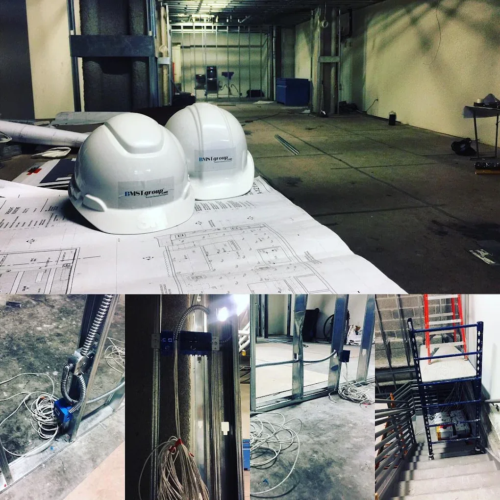Commercial buildout with hard hats, plans and structured cabling runs