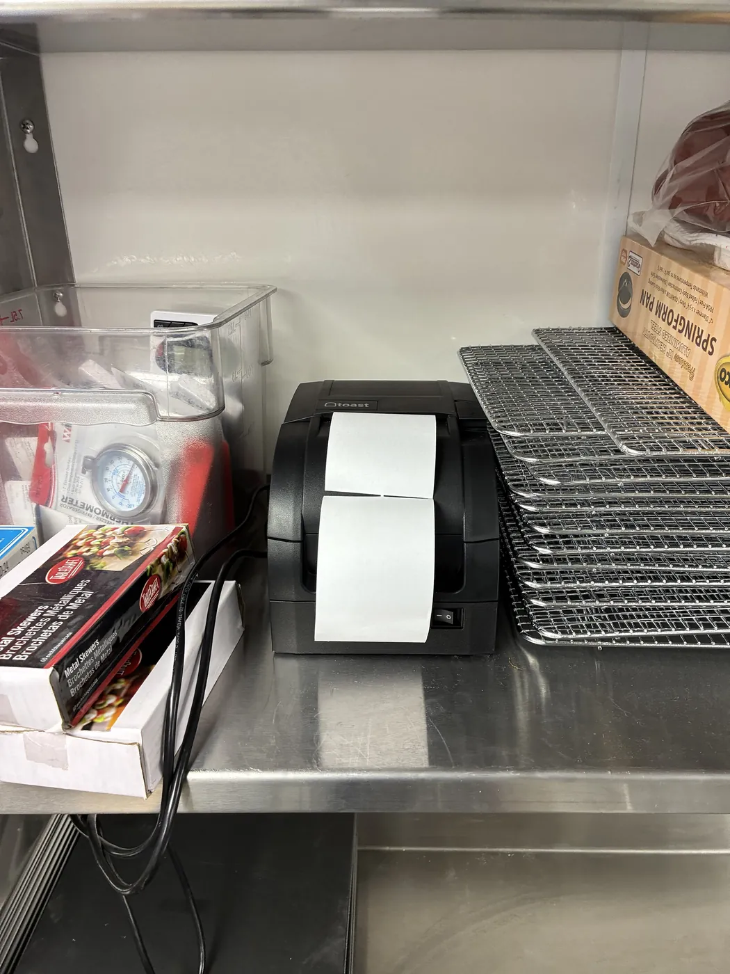 Toast kitchen printer at the line at Straker's