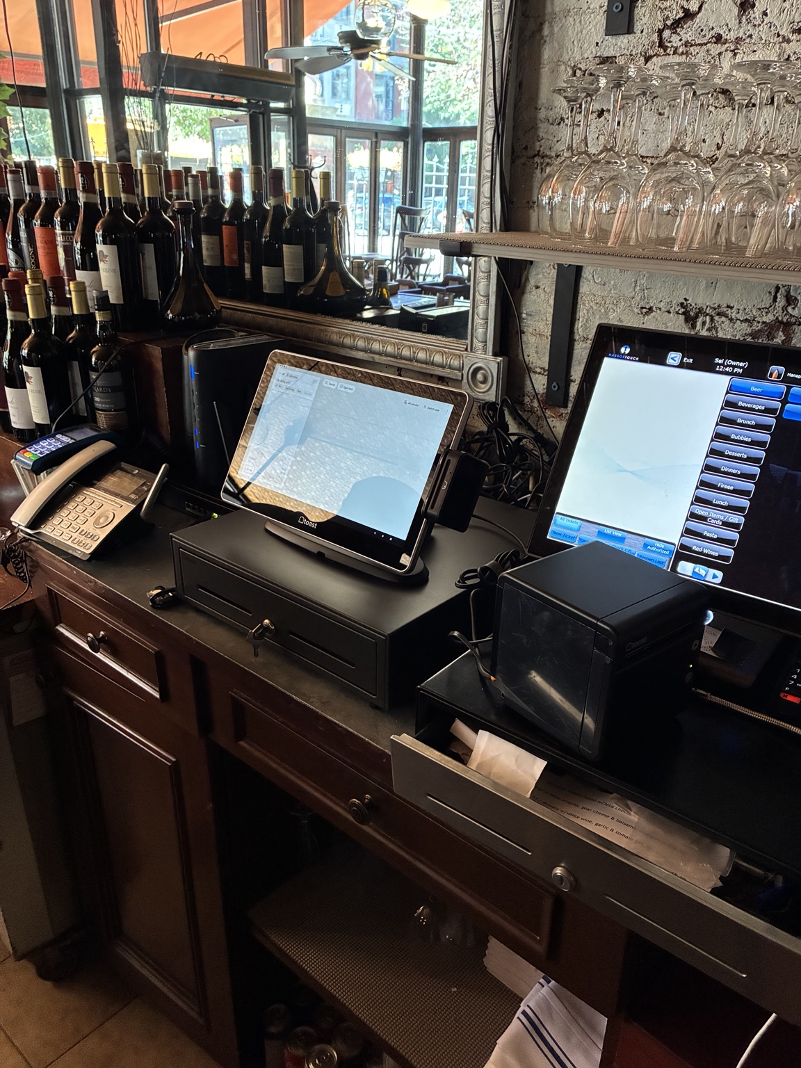 POS terminals and receipt printer on the counter at Mariella