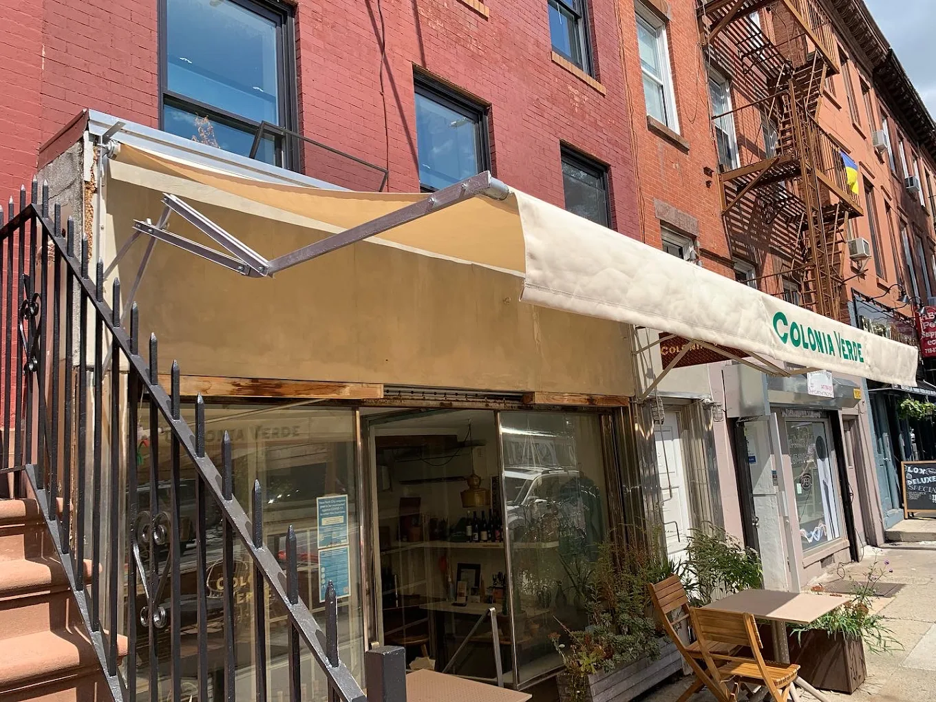 Tan storefront awning at Colonia Verde