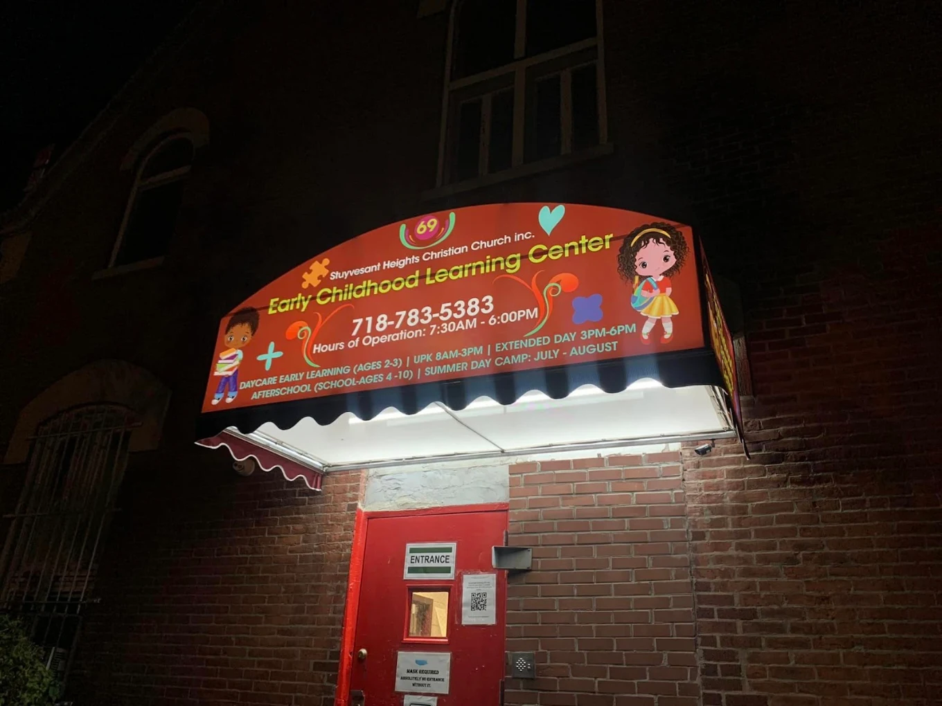 Red awning over the entrance of an early childhood learning center